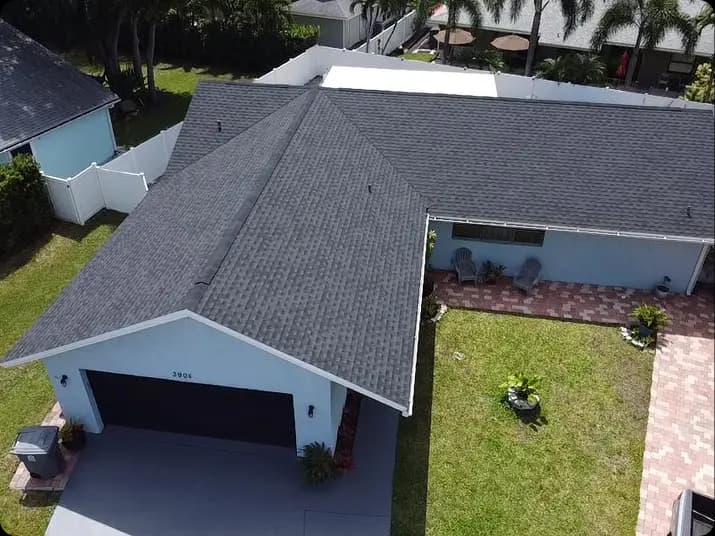 Aerial view of a completed architectural shingle roof replacement on a single-family home in South Florida.